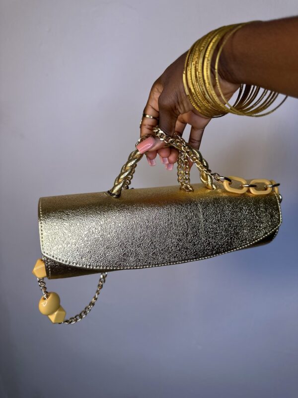 Gold cylindrical bag
