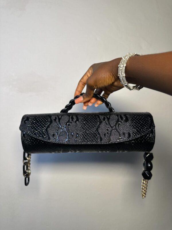 Black cylindrical handmade leather bag – The Braids Brand Ghana