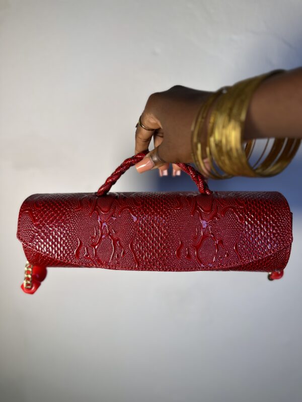 Red cylindrical handmade leather bag