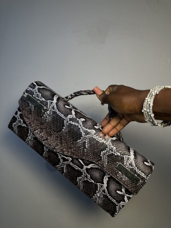 Handmade leather curved flap bag in chocolate snake skin